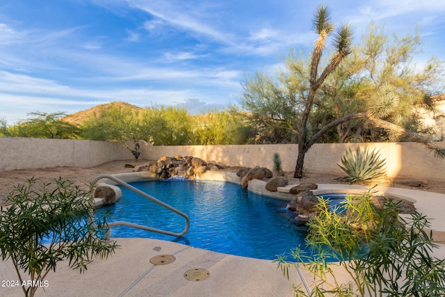 view of pool featuring pool water feature