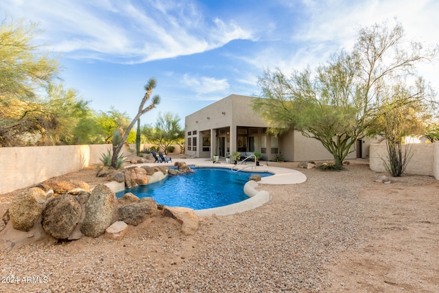 view of swimming pool with a patio area