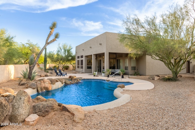 view of swimming pool with a patio