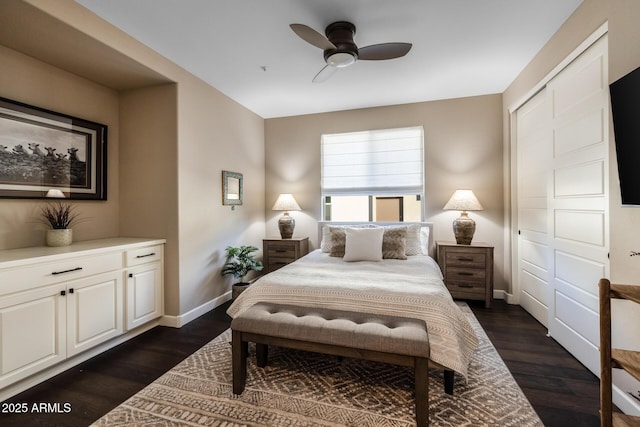 bedroom with dark wood-style floors, baseboards, and a ceiling fan