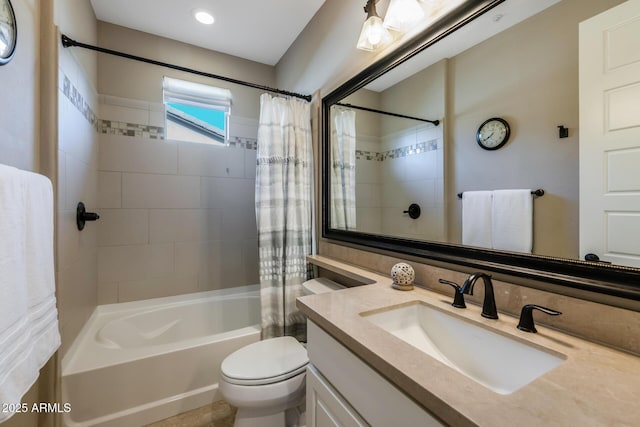 bathroom featuring shower / tub combo, vanity, and toilet