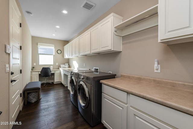 clothes washing area with cabinet space, visible vents, dark wood-style floors, washing machine and clothes dryer, and recessed lighting