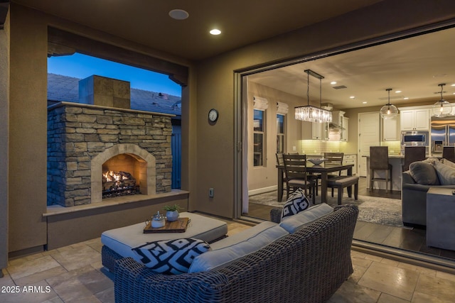 view of patio featuring an outdoor living space with a fireplace