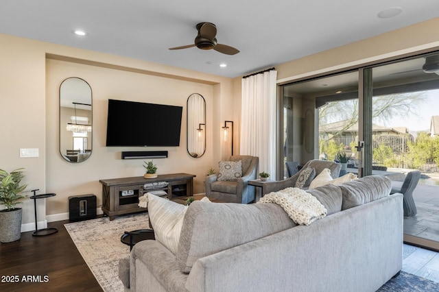 living area with ceiling fan, baseboards, wood finished floors, and recessed lighting