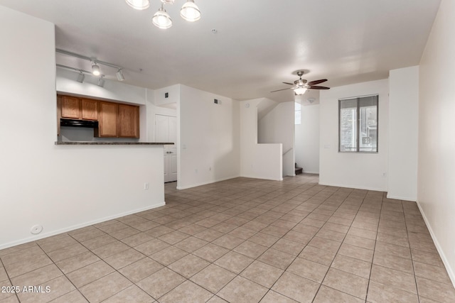 2402 E 5th St Unit 1411, Tempe, AZ 85288 - unfurnished living room with light tile patterned flooring, ceiling fan, and baseboards