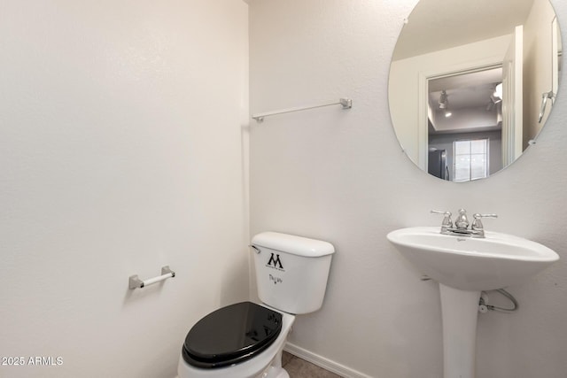 2402 E 5th St Unit 1411, Tempe, AZ 85288 - half bath with toilet, baseboards, and a sink