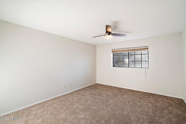 carpeted empty room with ceiling fan