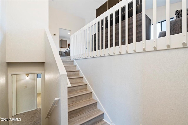 stairway featuring hardwood / wood-style floors