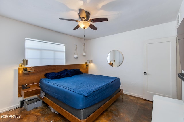 bedroom featuring a ceiling fan, baseboards, and concrete flooring