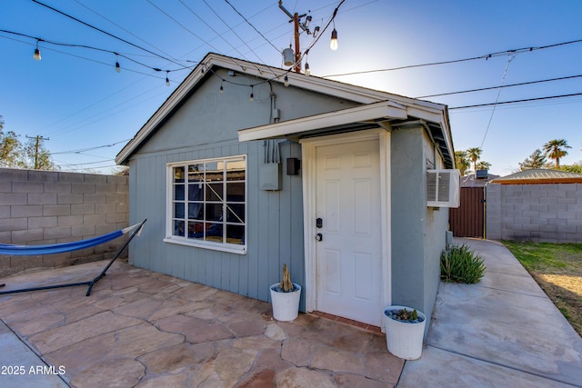 view of outdoor structure with a gate and fence