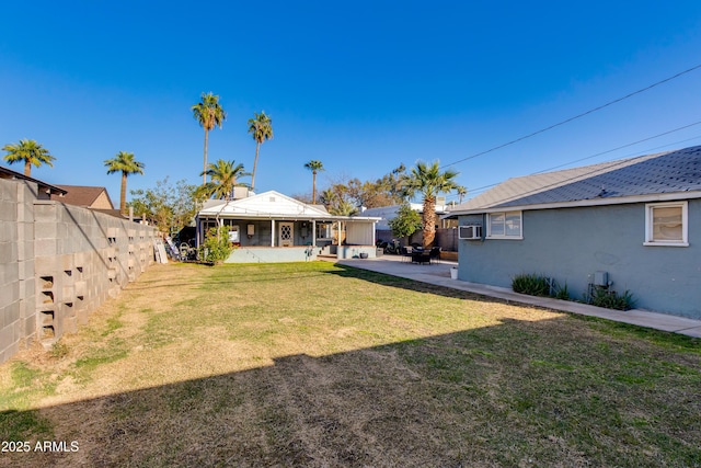 view of yard featuring a patio area, cooling unit, and a fenced backyard