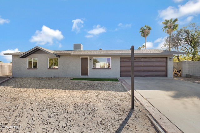 single story home with a garage