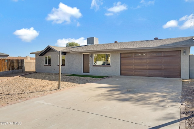 single story home with a garage