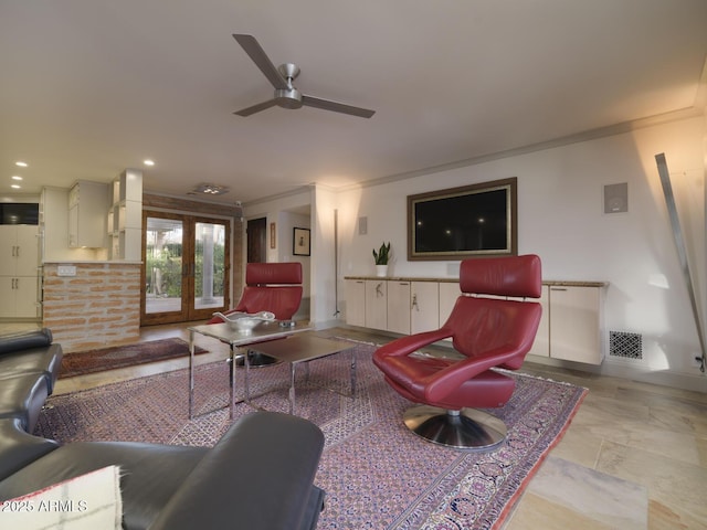 living room featuring ceiling fan, crown molding, and french doors