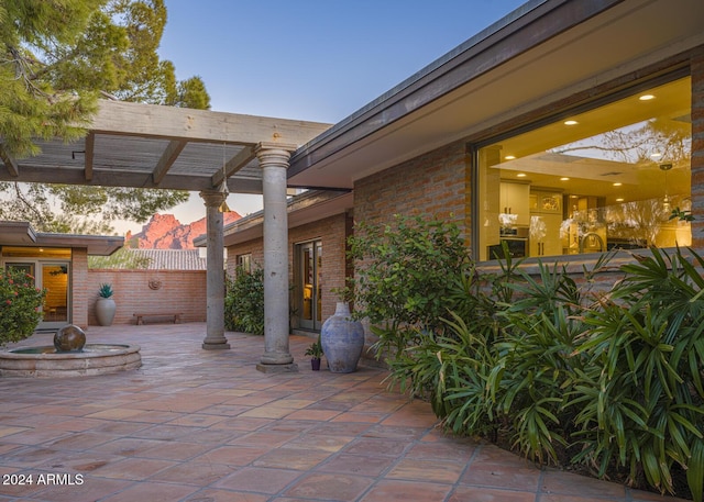 view of patio terrace at dusk