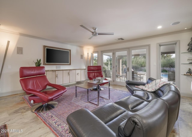 living room with ceiling fan, crown molding, and french doors