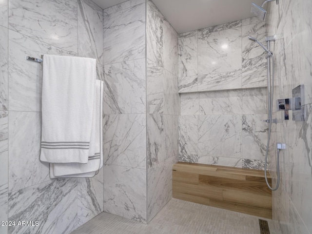 bathroom featuring tiled shower