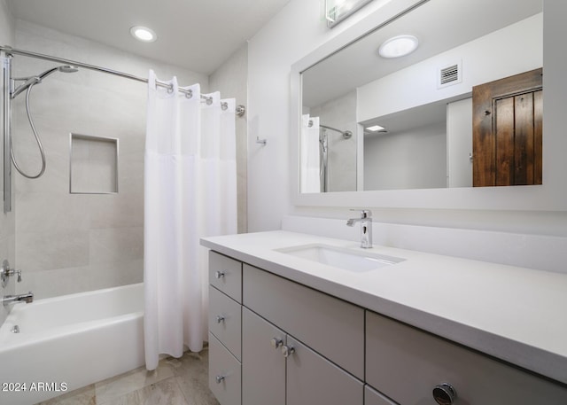 bathroom with vanity and shower / bath combo