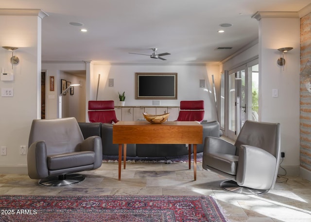 living room with ceiling fan and ornamental molding