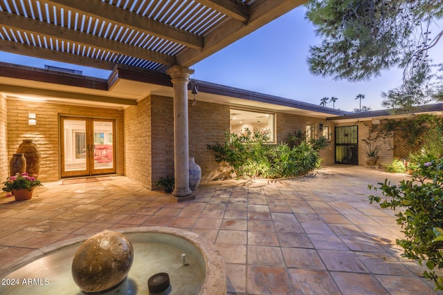 view of patio / terrace featuring a pergola and french doors