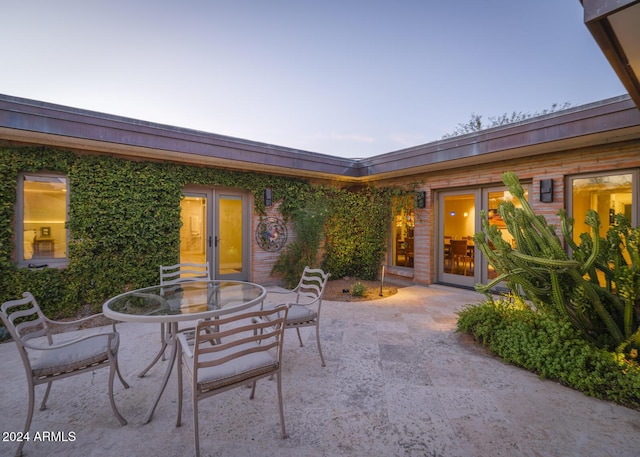 patio terrace at dusk with french doors