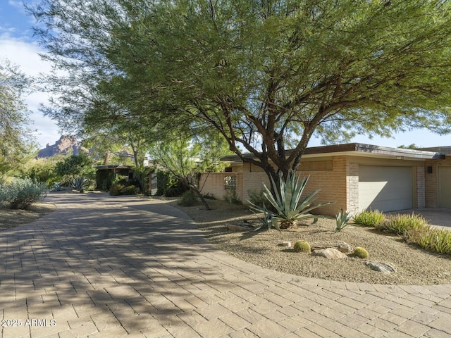 view of front of property featuring a mountain view and a garage