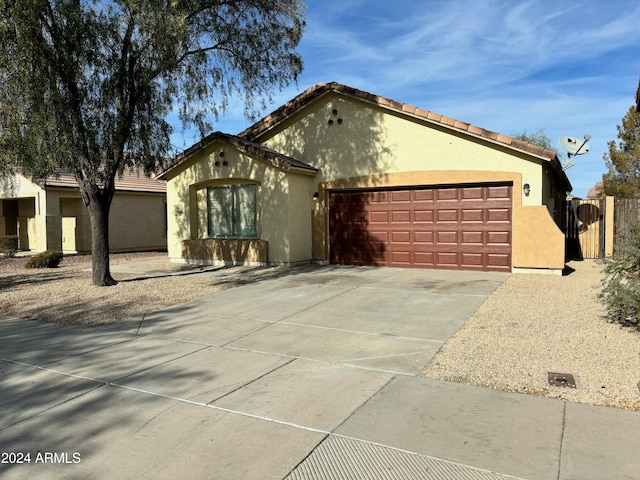 mediterranean / spanish-style house featuring a garage