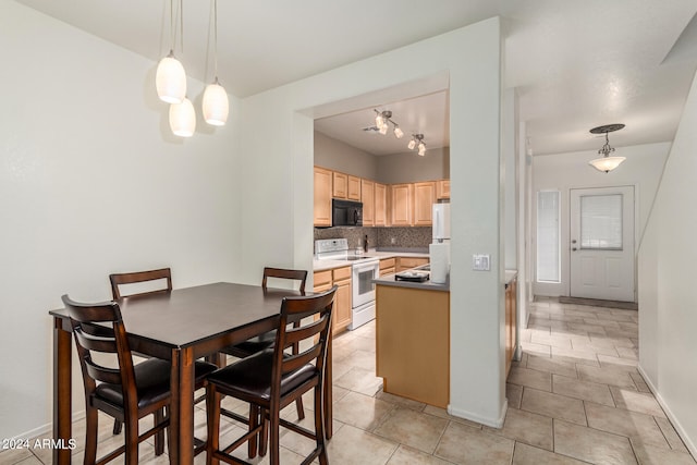 dining room featuring light tile patterned floors