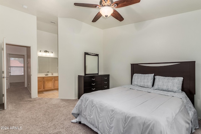 carpeted bedroom with ceiling fan and connected bathroom