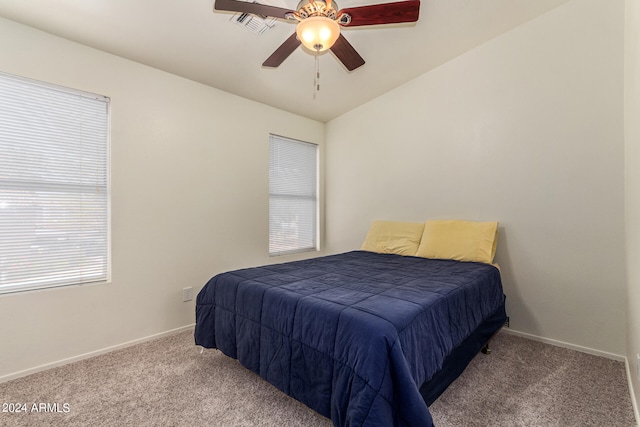 bedroom with carpet floors, vaulted ceiling, and ceiling fan