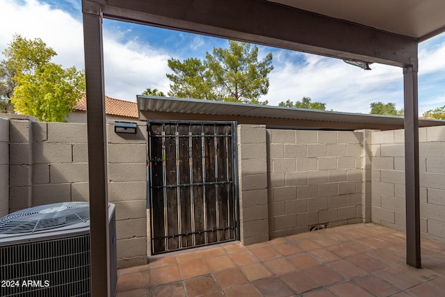 view of patio with central AC unit and an outdoor structure