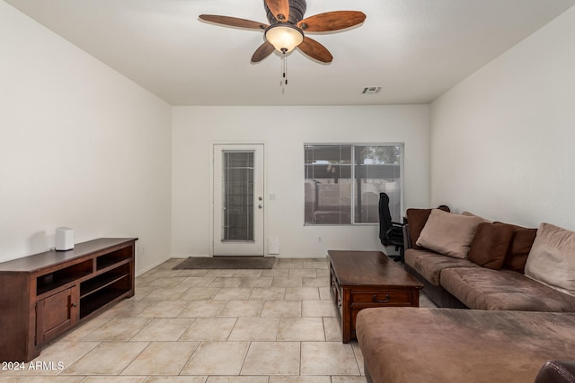 tiled living room with ceiling fan