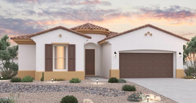 mediterranean / spanish-style house featuring a tile roof, an attached garage, stucco siding, and driveway
