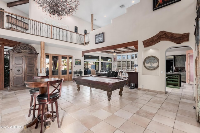 playroom with french doors, beverage cooler, light tile patterned floors, billiards, and a high ceiling