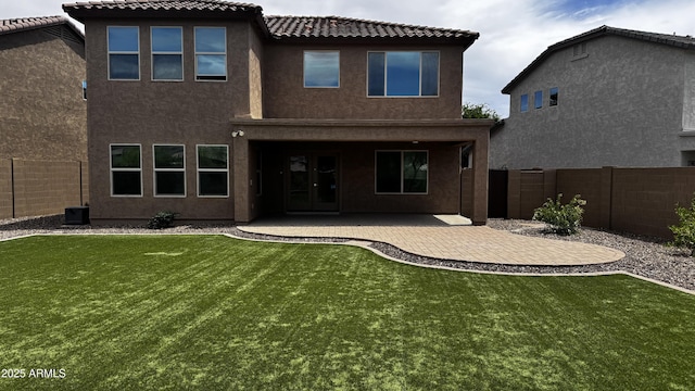 1854 W Fetlock Trl, Phoenix, AZ 85085 - back of property with stucco siding, a patio area, and a tile roof