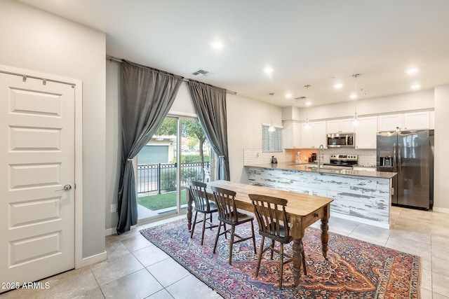 dining space with light tile patterned floors