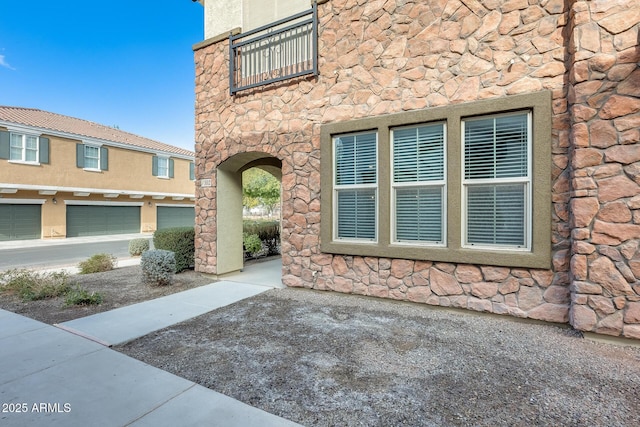 doorway to property with a garage