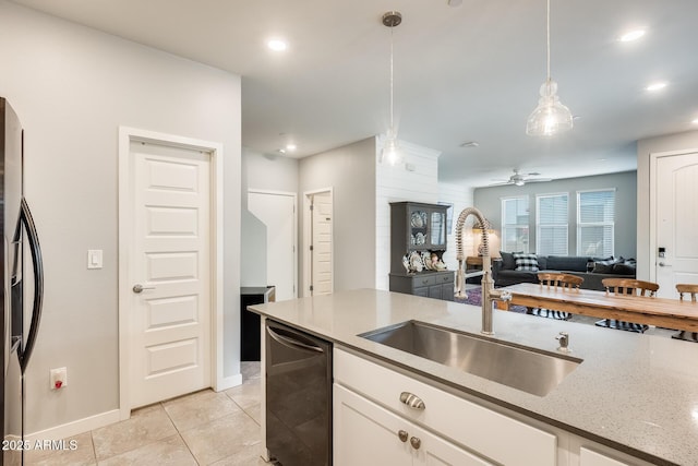 kitchen featuring white cabinets, decorative light fixtures, sink, and dishwasher