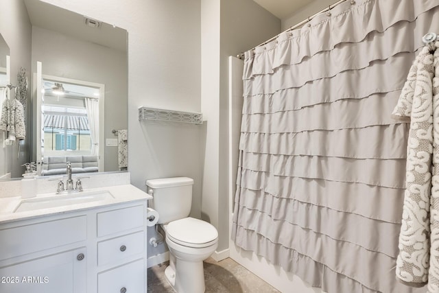 full bathroom with vanity, ceiling fan, toilet, and shower / bath combo with shower curtain