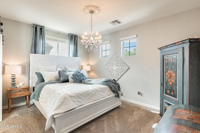 bedroom featuring a chandelier and carpet flooring