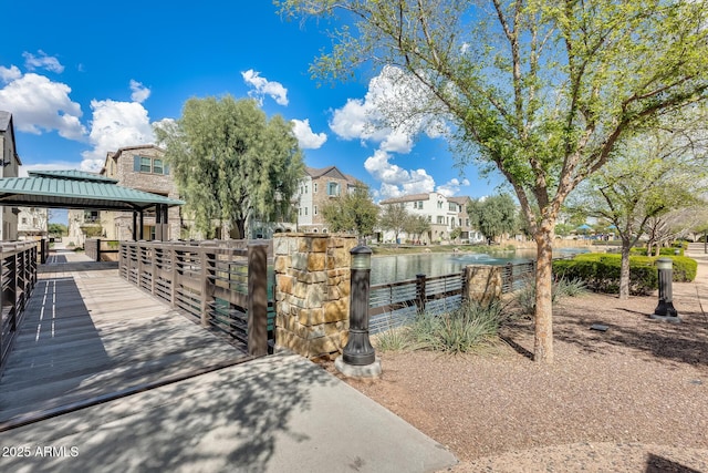 dock area with a gazebo and a water view