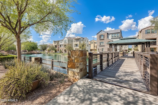 dock area featuring a gazebo and a water view