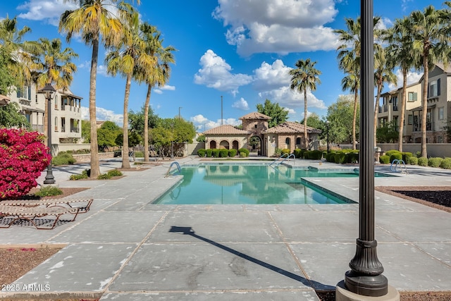 view of swimming pool with a patio area