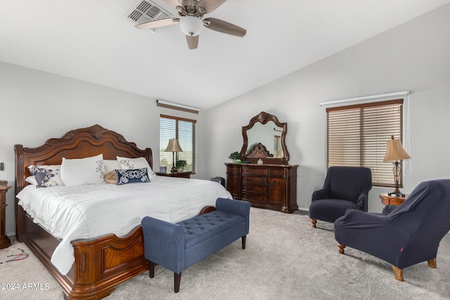 carpeted bedroom with vaulted ceiling and ceiling fan