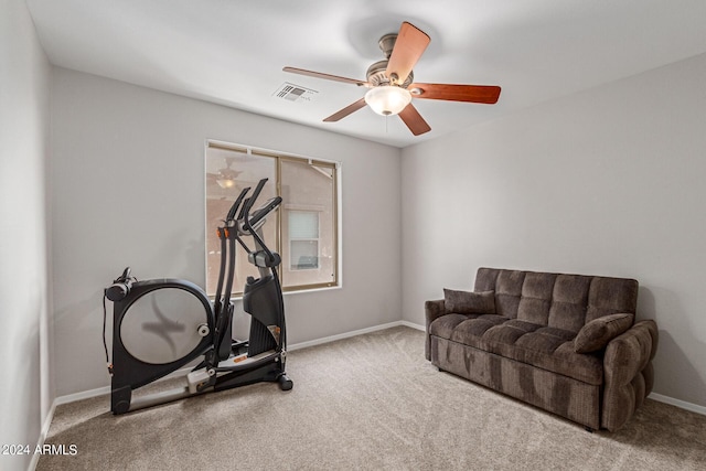 workout area with light carpet, baseboards, visible vents, and ceiling fan