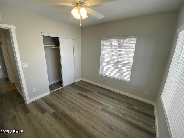 2709 E Willetta St, Phoenix, AZ 85008 - unfurnished bedroom featuring a closet, baseboards, ceiling fan, and dark wood finished floors