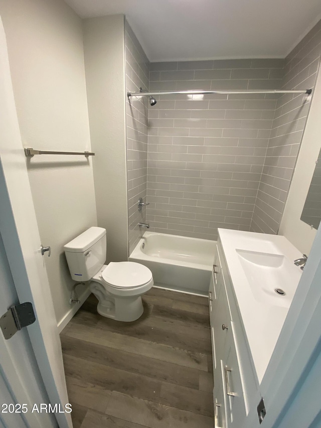 2709 E Willetta St, Phoenix, AZ 85008 - full bathroom featuring toilet, wood finished floors, vanity, and shower / bathtub combination