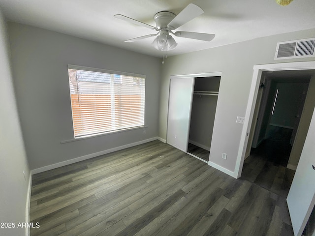 2709 E Willetta St, Phoenix, AZ 85008 - unfurnished bedroom with visible vents, baseboards, a closet, ceiling fan, and wood finished floors