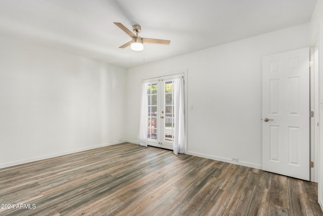 spare room featuring ceiling fan and dark hardwood / wood-style floors