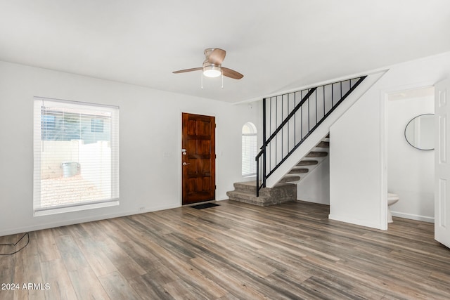 entryway with ceiling fan and wood-type flooring